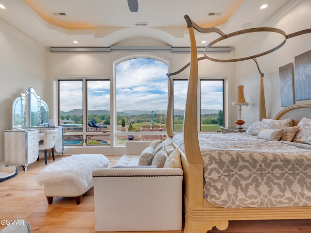 bedroom featuring visible vents, recessed lighting, and a mountain view
