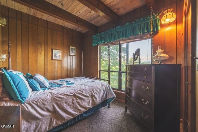 carpeted bedroom with beam ceiling, wood walls, and wood ceiling