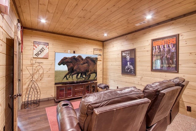 home theater featuring visible vents, wood ceiling, wood finished floors, wood walls, and recessed lighting