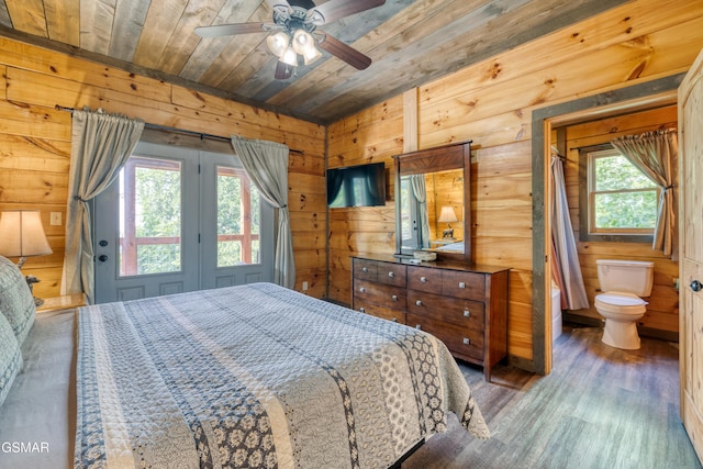 809 Pinecrest Way, Sevierville, TN 37862 - bedroom with wooden ceiling, wooden walls, wood finished floors, connected bathroom, and access to exterior