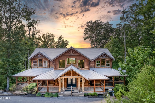 809 Pinecrest Way, Sevierville, TN 37862 - cabin featuring covered porch, log siding, metal roof, and french doors