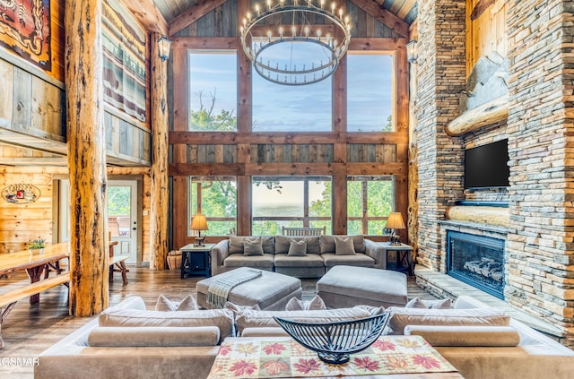 809 Pinecrest Way, Sevierville, TN 37862 - living area with high vaulted ceiling, hardwood / wood-style floors, a chandelier, healthy amount of natural light, and a fireplace