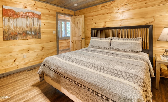 809 Pinecrest Way, Sevierville, TN 37862 - bedroom with wooden walls, wood finished floors, and wooden ceiling