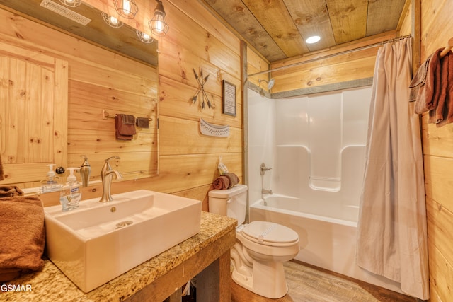 809 Pinecrest Way, Sevierville, TN 37862 - full bathroom with wood walls, toilet, shower / bath combination with curtain, wood ceiling, and a sink