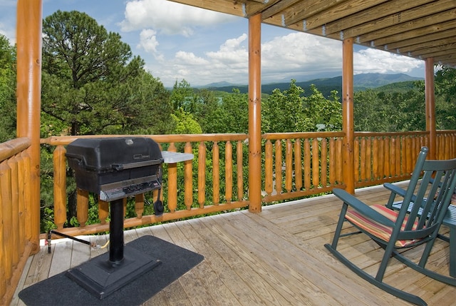 deck featuring a mountain view and area for grilling