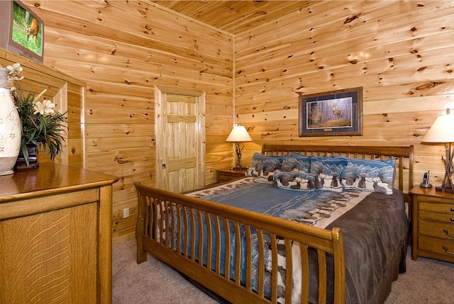 bedroom with carpet and wood ceiling