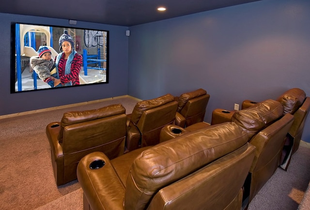 home theater room with light colored carpet