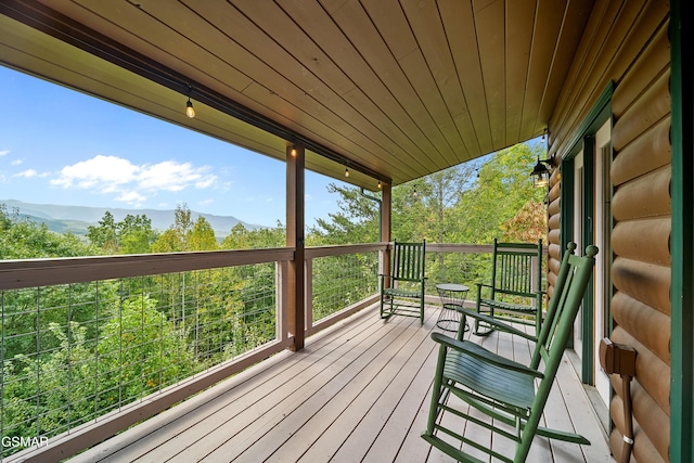 wooden terrace with a mountain view