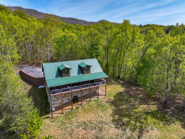 birds eye view of property featuring a mountain view