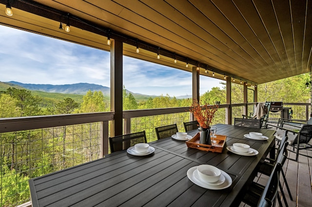 wooden deck featuring a mountain view