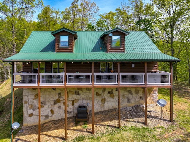 back of house featuring a wooden deck and central air condition unit