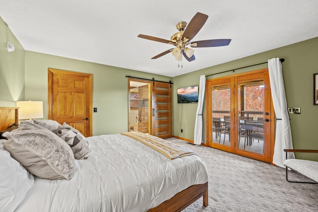 carpeted bedroom featuring a barn door, access to outside, and ceiling fan