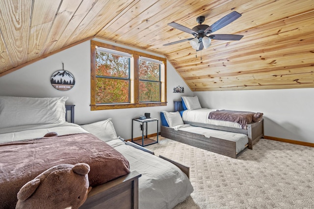 carpeted bedroom featuring ceiling fan, wooden ceiling, and vaulted ceiling