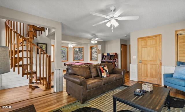 living room featuring stairway and wood finished floors