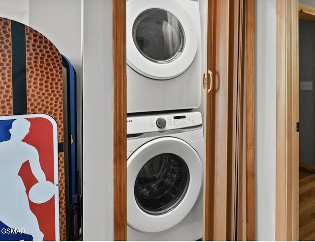 laundry room featuring stacked washing maching and dryer