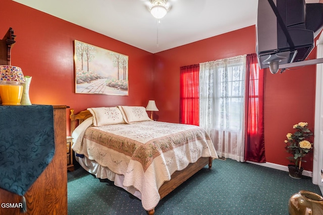 carpeted bedroom featuring baseboards