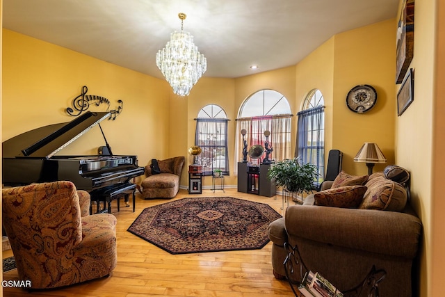 living room featuring recessed lighting, hardwood / wood-style floors, and a chandelier
