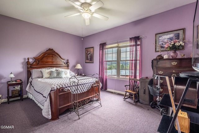 carpeted bedroom featuring baseboards and a ceiling fan