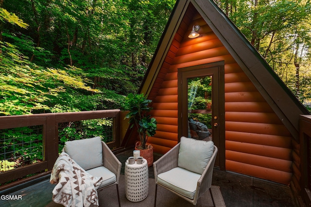 view of outbuilding with a forest view