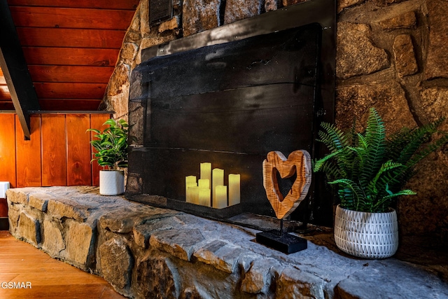 details featuring wood walls and wood finished floors