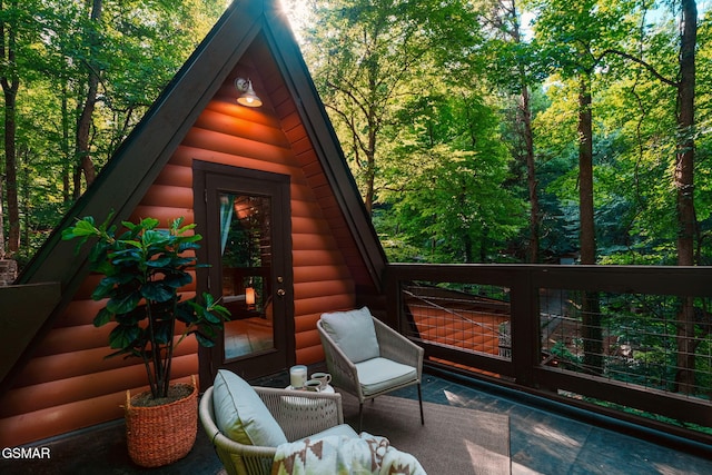 view of outbuilding featuring a wooded view