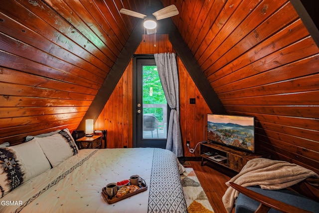 bedroom featuring wood-type flooring, wooden walls, access to exterior, and wooden ceiling