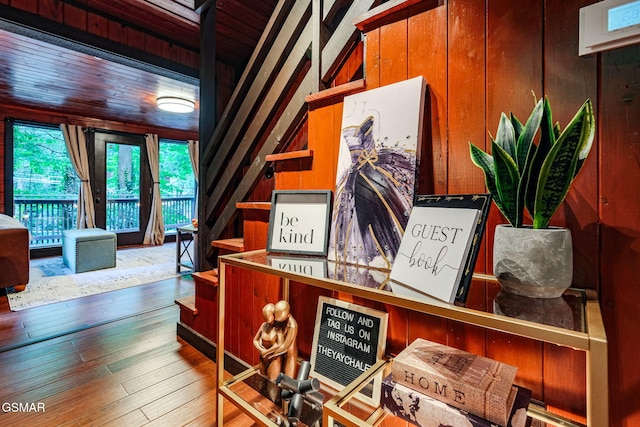 room details featuring wood walls and wood finished floors