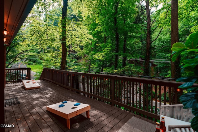 deck featuring a view of trees