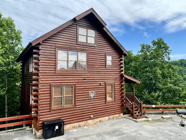 2867 White Oak Ridge Ln, Sevierville, TN 37862 - view of property exterior featuring log siding and a patio
