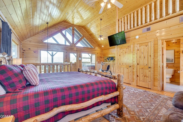 2867 White Oak Ridge Ln, Sevierville, TN 37862 - bedroom featuring wood walls, lofted ceiling, and wooden ceiling