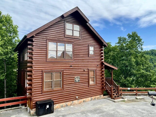 2867 White Oak Ridge Ln, Sevierville, TN 37862 - view of property exterior featuring log siding and a patio area