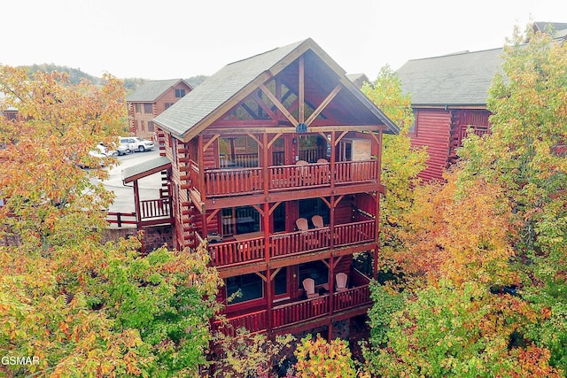 2867 White Oak Ridge Ln, Sevierville, TN 37862 - rear view of house with log exterior and a balcony