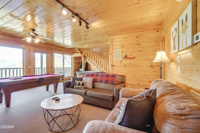 2867 White Oak Ridge Ln, Sevierville, TN 37862 - carpeted living room with track lighting, pool table, wooden walls, stairs, and wood ceiling