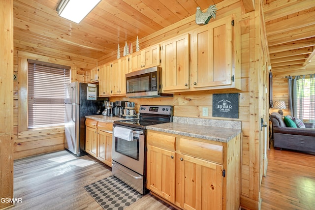 2867 White Oak Ridge Ln, Sevierville, TN 37862 - kitchen with appliances with stainless steel finishes, light brown cabinets, light wood finished floors, wooden walls, and wooden ceiling
