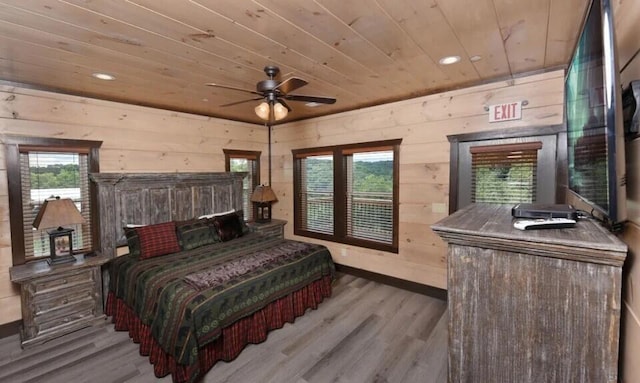 bedroom featuring wood ceiling, multiple windows, recessed lighting, and wood finished floors