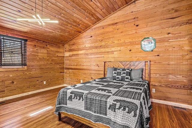 bedroom with wooden ceiling, wooden walls, and vaulted ceiling