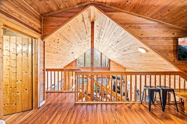 bonus room with hardwood / wood-style floors, vaulted ceiling, wood walls, and wooden ceiling