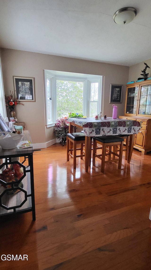 dining area with light wood-type flooring