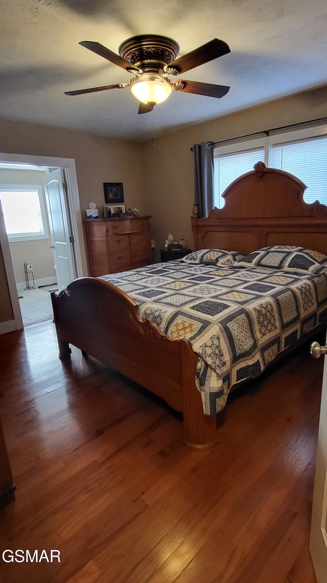 bedroom with hardwood / wood-style flooring and ceiling fan