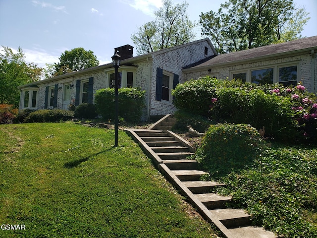 exterior space with a lawn