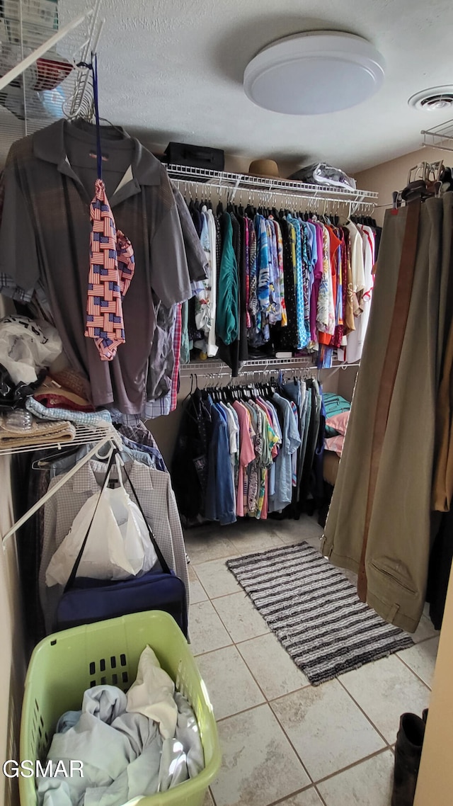 walk in closet featuring light tile patterned floors