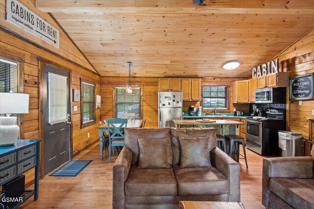 living room featuring wooden walls, wooden ceiling, light hardwood / wood-style flooring, and lofted ceiling