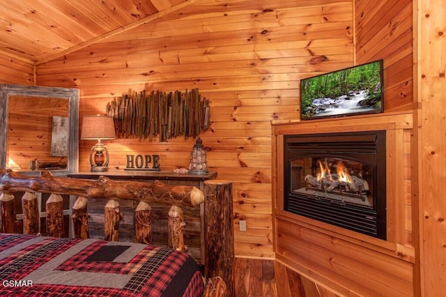 bedroom with vaulted ceiling and wood ceiling