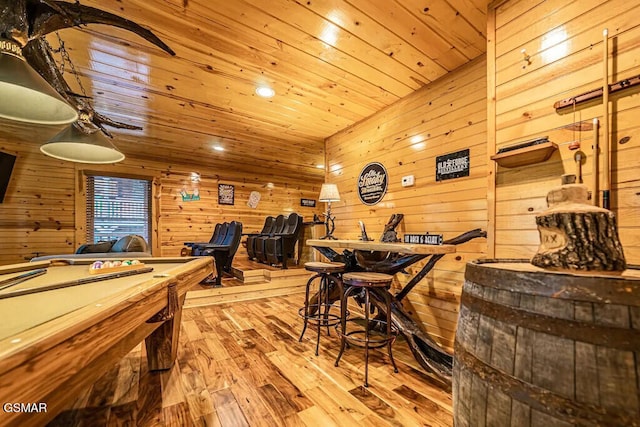 recreation room with pool table, wood ceiling, hardwood / wood-style floors, and wooden walls