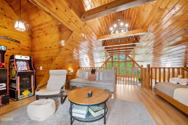 living area with wood ceiling, an inviting chandelier, wood finished floors, and vaulted ceiling with beams