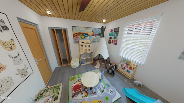 rec room featuring wood ceiling and wood finished floors