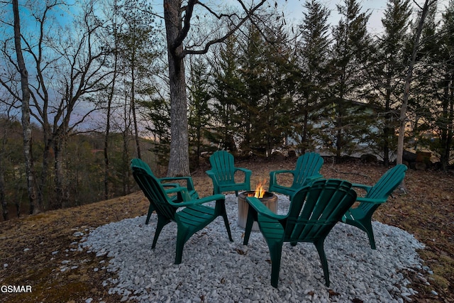 view of yard with a fire pit