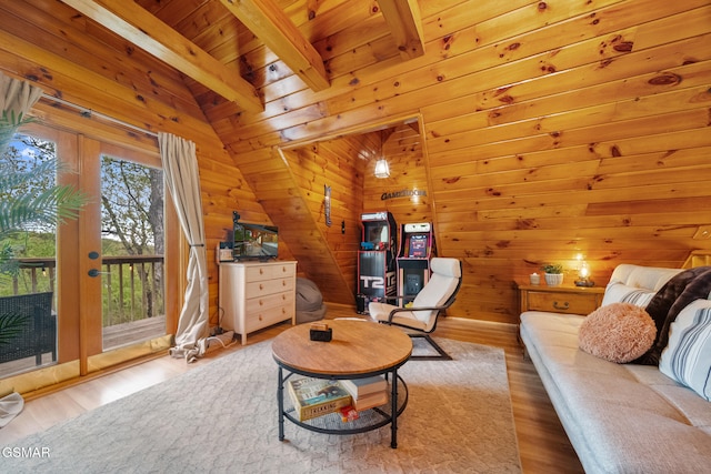 interior space with wood finished floors, wood walls, wood ceiling, and lofted ceiling with beams