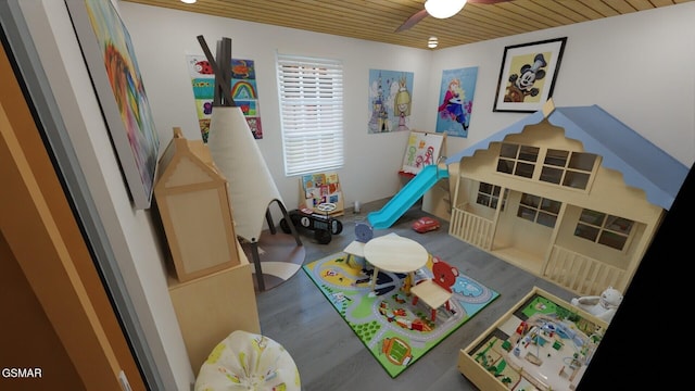 recreation room featuring wooden ceiling, ceiling fan, and wood finished floors