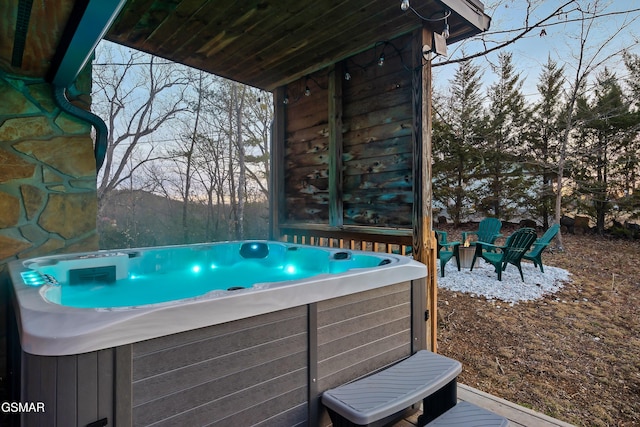 exterior space with a hot tub